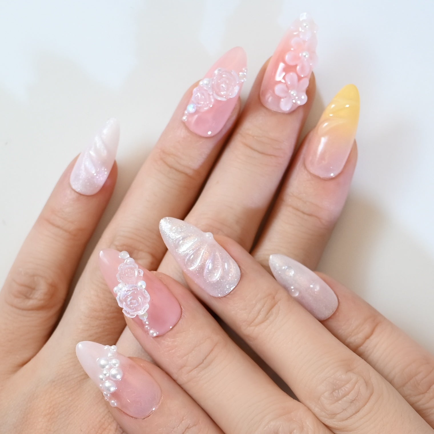 Elegant spring press-on nails with pastel gradient, 3D roses, and pearl embellishment"