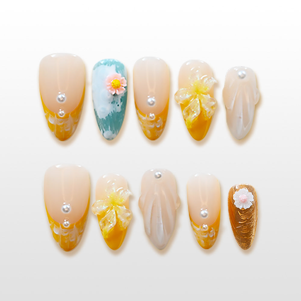 Yellow floral press-on nails with pearls and hand-painted flower accents