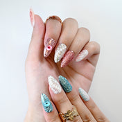 Ocean blue press-on nails with 3D rose design, seashell texture, and water drop effect