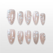 Nude shimmer press-on nails with 3D pearl accents and silver bead details