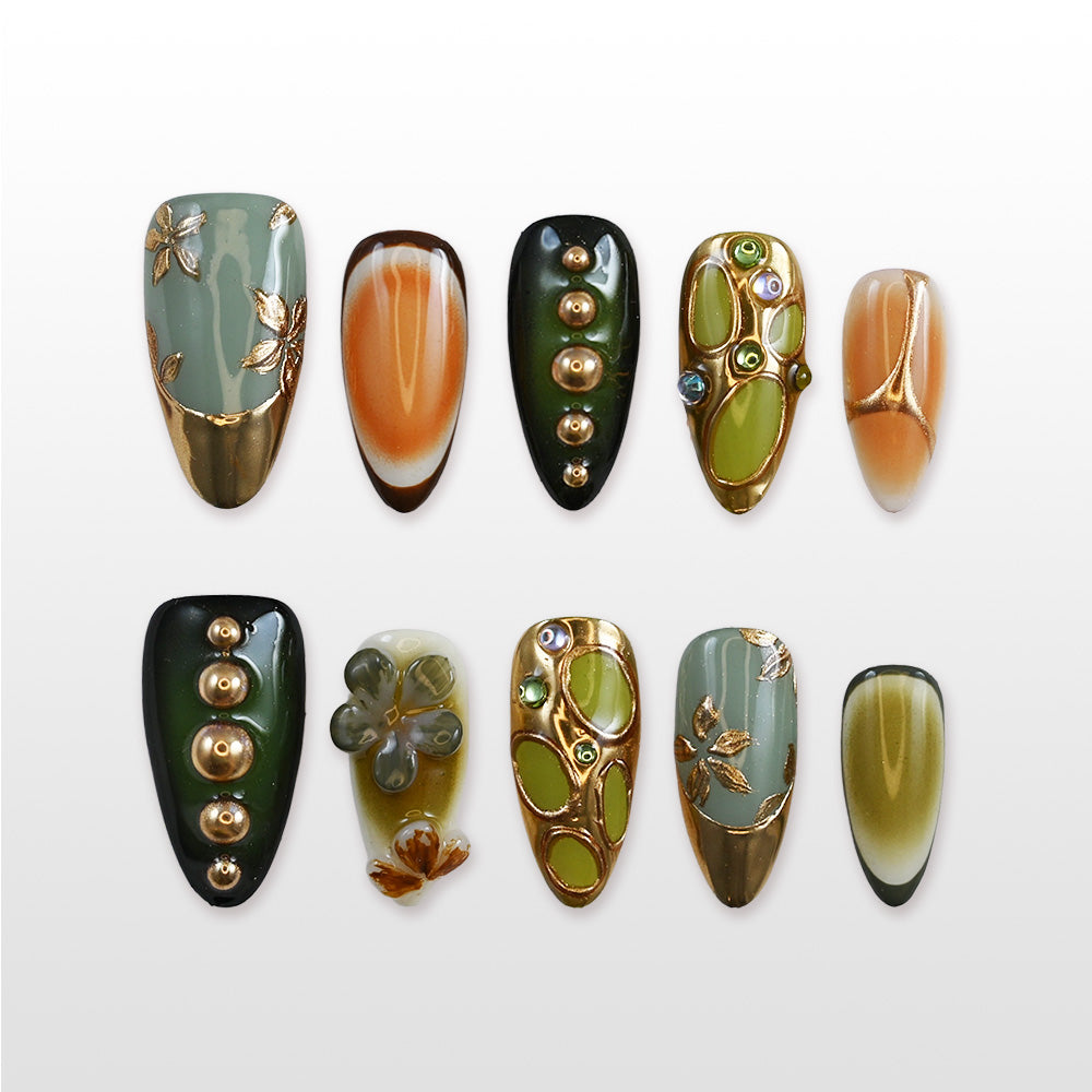 Luxury autumn press-on nails in olive green, gold, and amber gradient