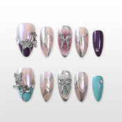 Iridescent silver and pink press-on nails with 3D butterfly charms and gemstone accents