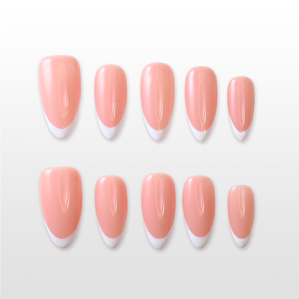 Minimalist press-on nails featuring soft pink base and sleek French tip design