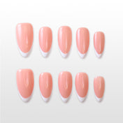 Minimalist press-on nails featuring soft pink base and sleek French tip design
