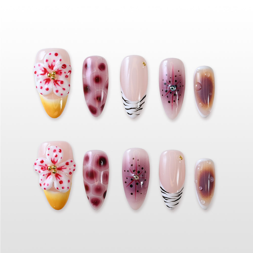 Handmade glossy almond nails in wine red, nude, and gold with floral and animal print details