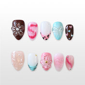 Handmade almond nails featuring chocolate drips, pink ombré and cute candy heart patterns