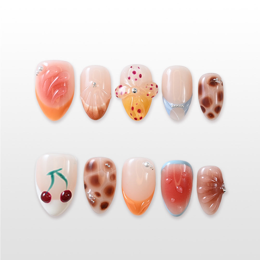 Handmade glossy nails featuring giraffe print, seashell texture and playful fruit accents