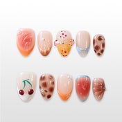Handmade glossy nails featuring giraffe print, seashell texture and playful fruit accents