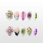 Almond shaped handmade nails with polka dots and kiwi pattern