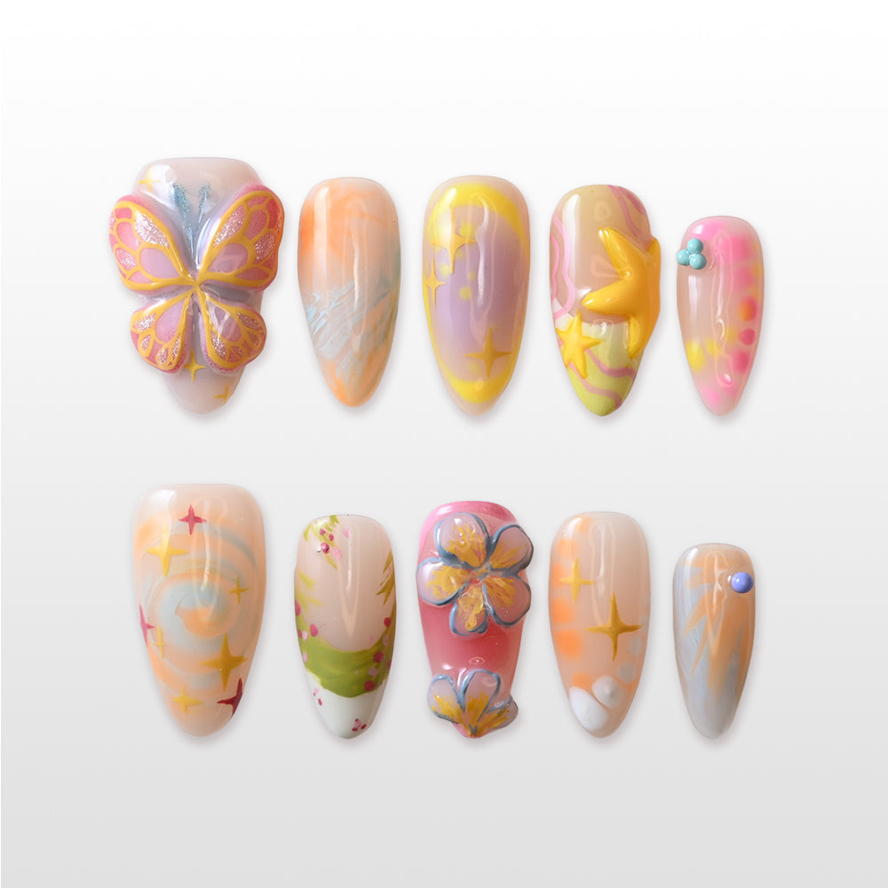 Pink and yellow gradient press-on nails with summer vacation vibes