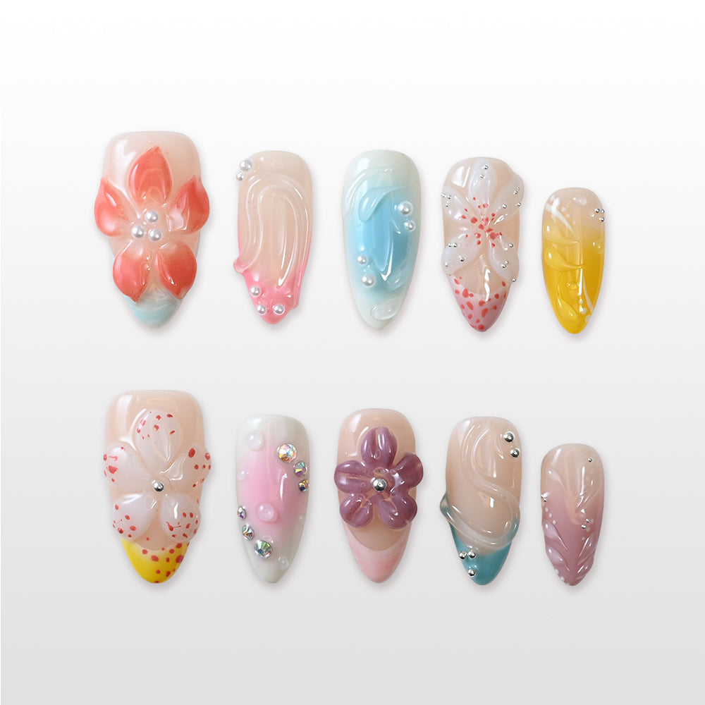 Vibrant boho press-on nails featuring coral, turquoise, pink and yellow tones