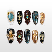 Charmeenail gothic press on nails with gold cross charms, gemstone flowers, and sculpted textures