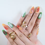Handmade almond-shaped press on nails featuring lava cracks, abstract textures, and jelly details