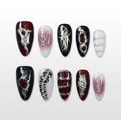 Charmeenail edgy press on nails with silver metal textures, spiderweb patterns, and black-red tones