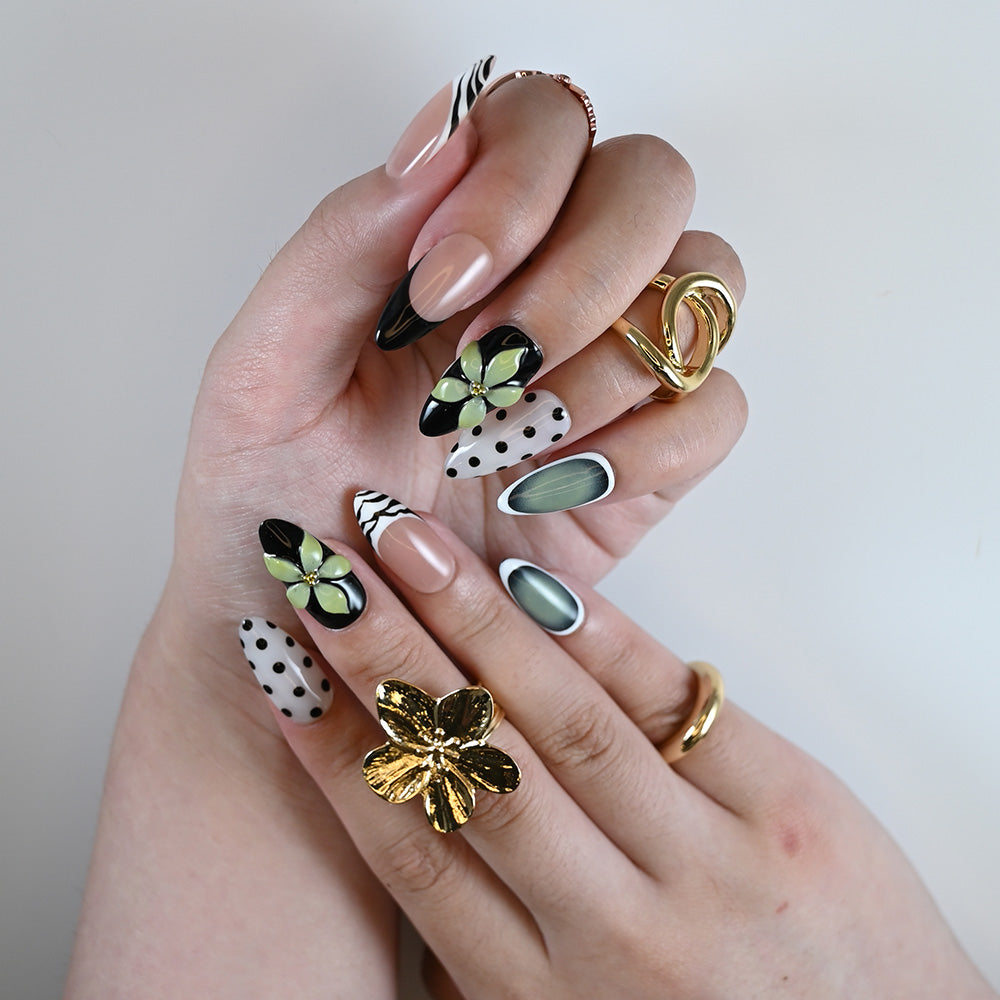 Handmade fashion-forward press on nails with green sculpted petals and high gloss finish