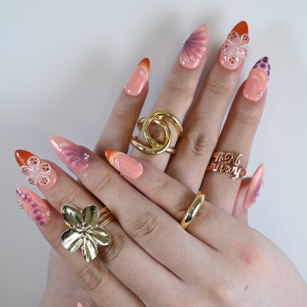 Handmade bold press on nails with abstract floral designs and high-shine finish