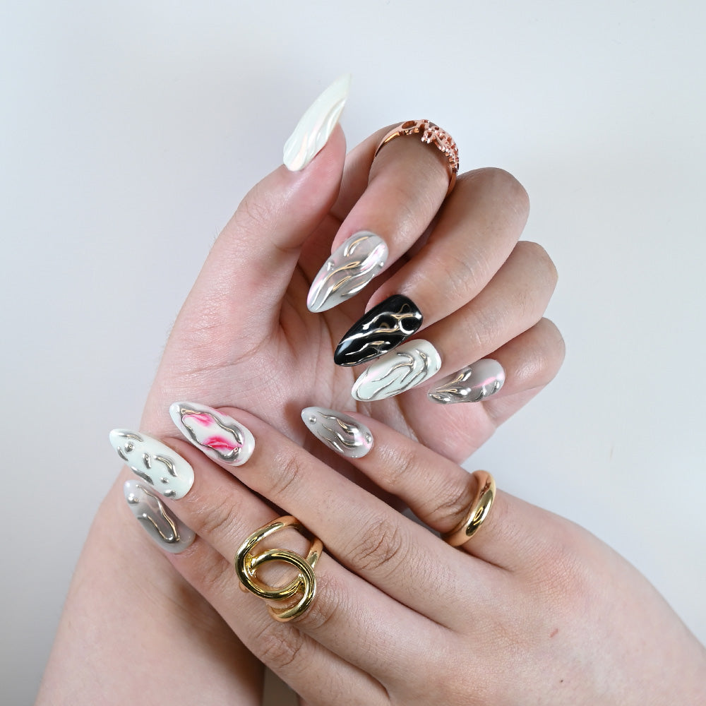 White, pink, and black almond nails with 3D liquid metal effect and futuristic texture