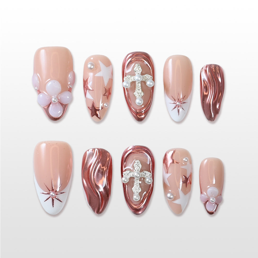 Reusable press on nails with sculpted rose gold texture and delicate floral and pearl elements