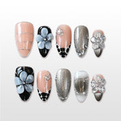 Charmeenail nude and black press on nails with 3D flower design and metallic accents