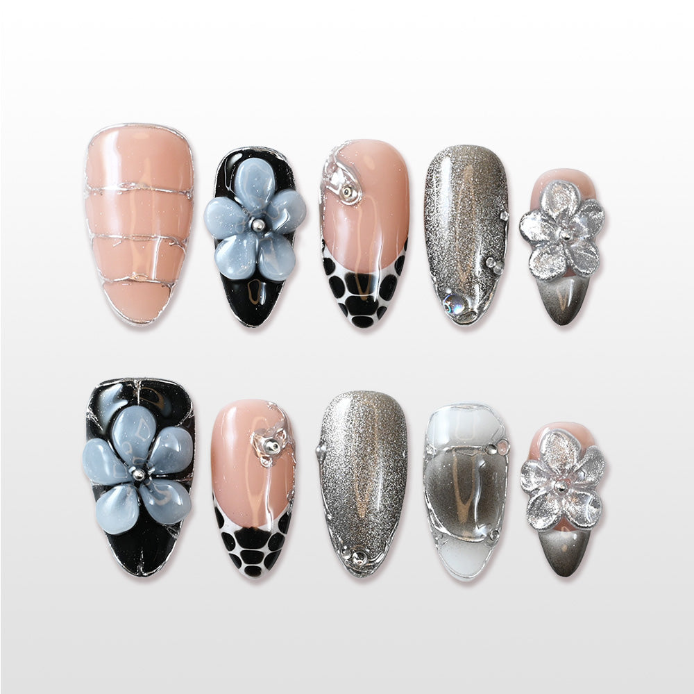 Charmeenail nude and black press on nails with 3D flower design and metallic accents