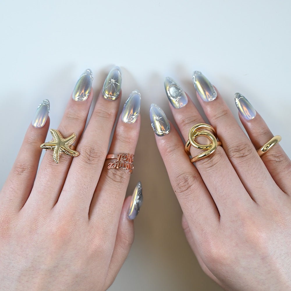 Galaxy themed press on nails in silver chrome with celestial patterns and 3D accents