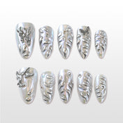 Charmeenail handmade sculpted press ons with holographic shine and butterfly accents