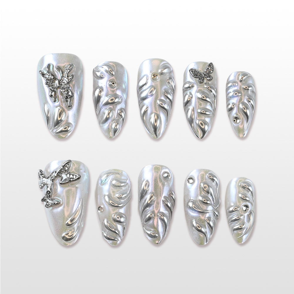 Charmeenail handmade sculpted press ons with holographic shine and butterfly accents