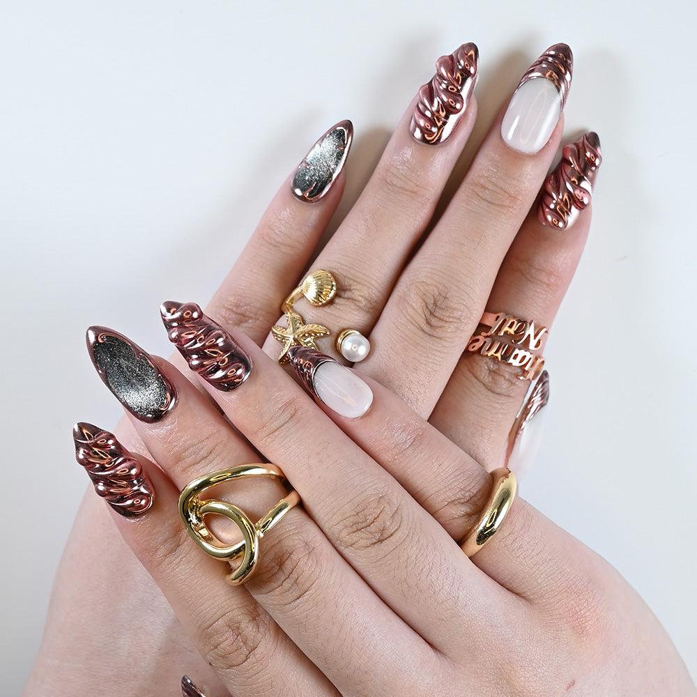 Acrylic French tip press on nails with shiny sculpted design and fashion jewelry