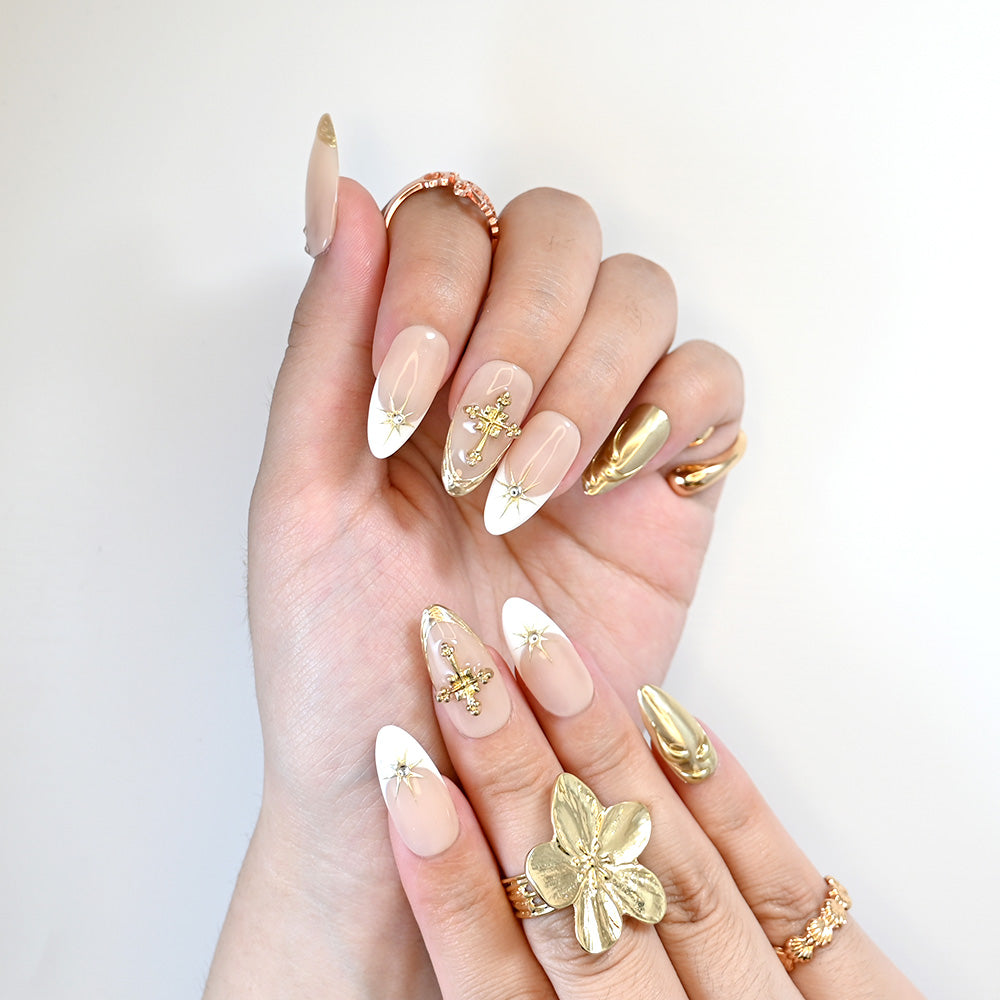 Luxury Christian style nails with gold crosses, 3D metallic details, and glossy finish