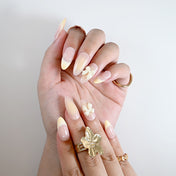 Elegant pastel ombre press-on nails with creamy bow and pearl embellishments