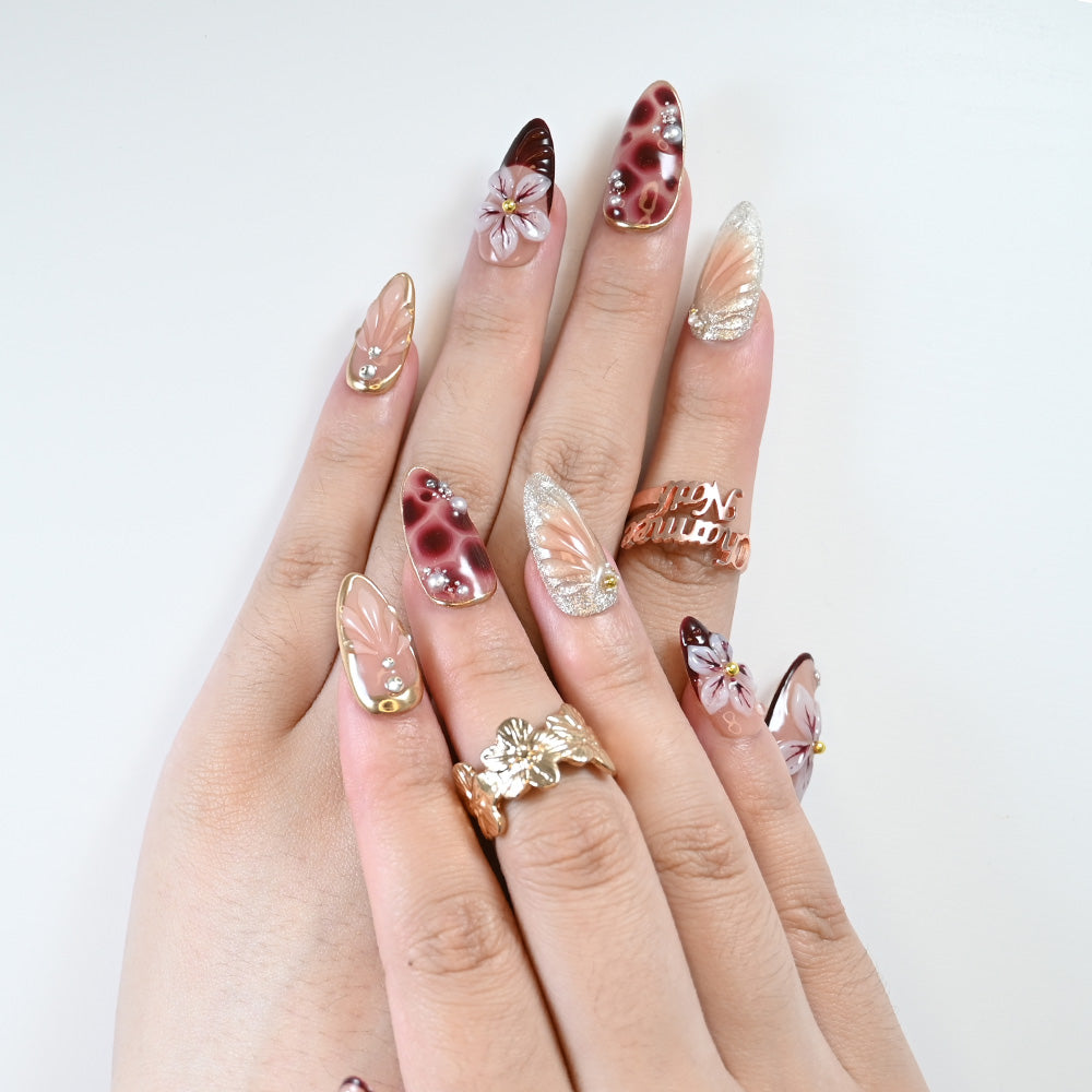 Salon-quality burgundy and nude gradient nails with 3D blossoms