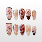 Handmade burgundy press-on nails with 3D floral art and glitter details