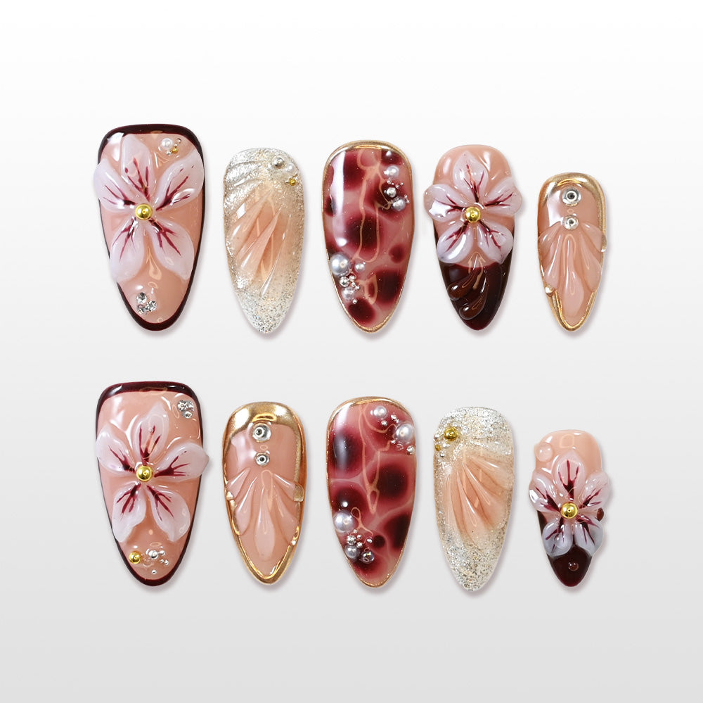 Handmade burgundy press-on nails with 3D floral art and glitter details