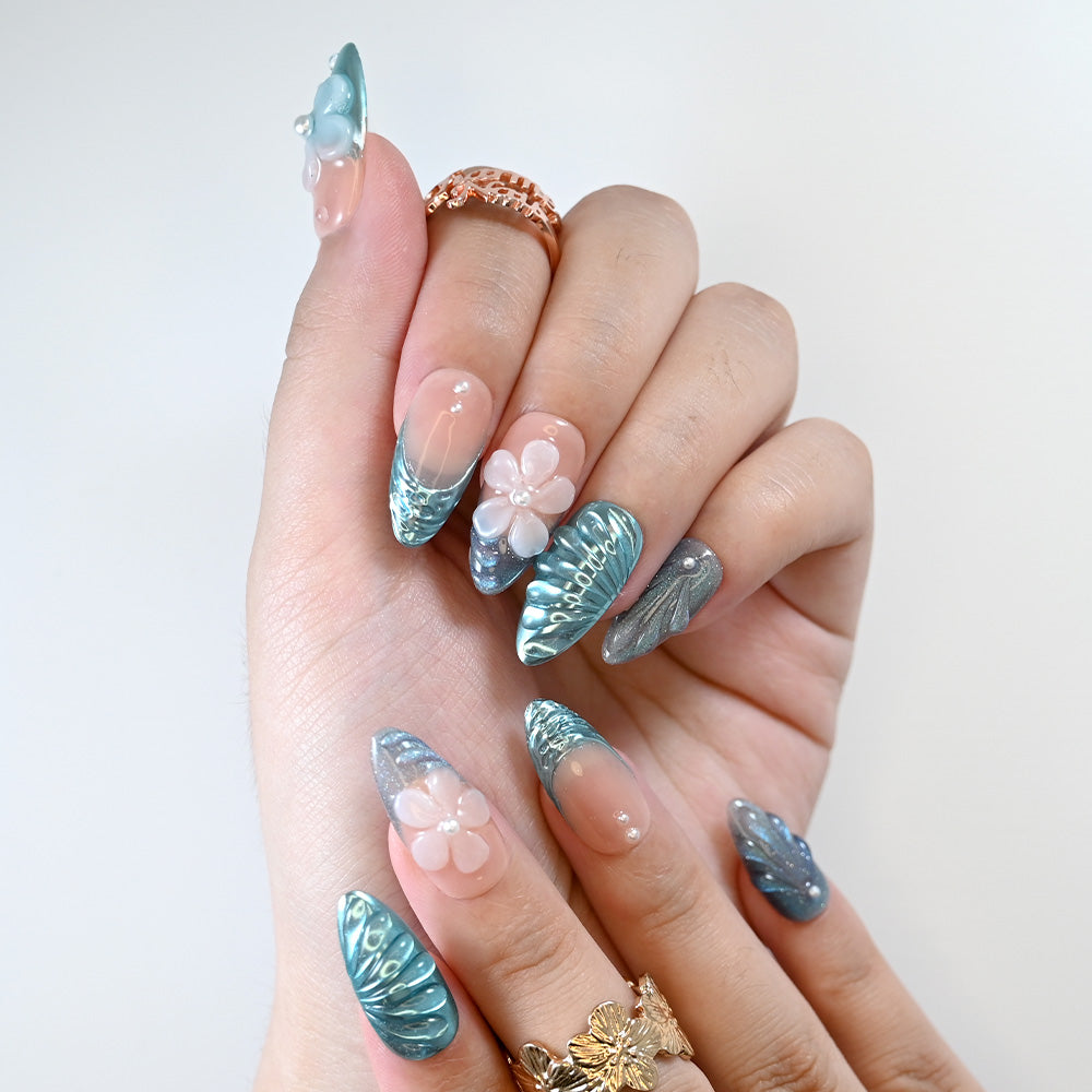 Blue shimmer ocean press-on nails with floral design