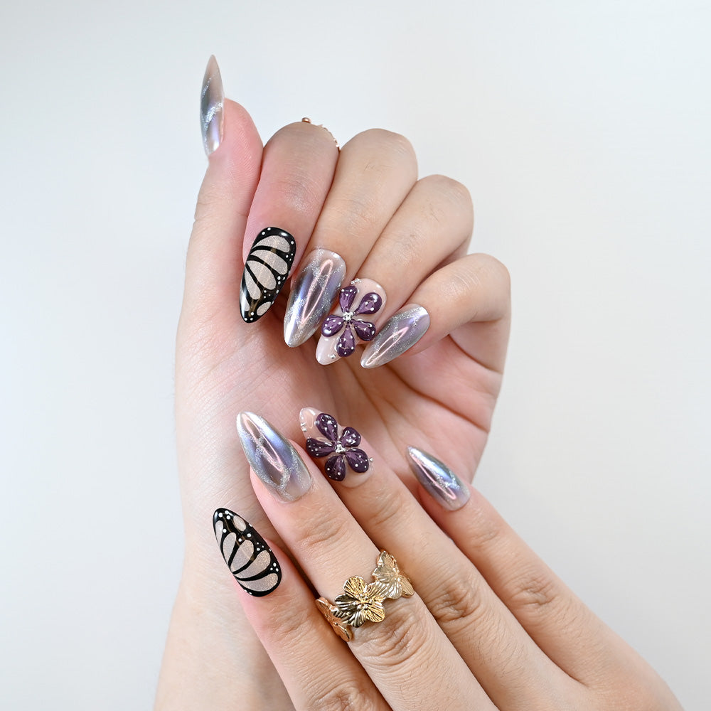 Handmade acrylic nails with shimmer chrome effect and floral accents