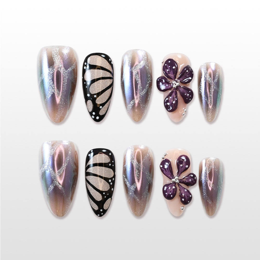 Iridescent press-on nails with butterfly wing and 3D purple flower design