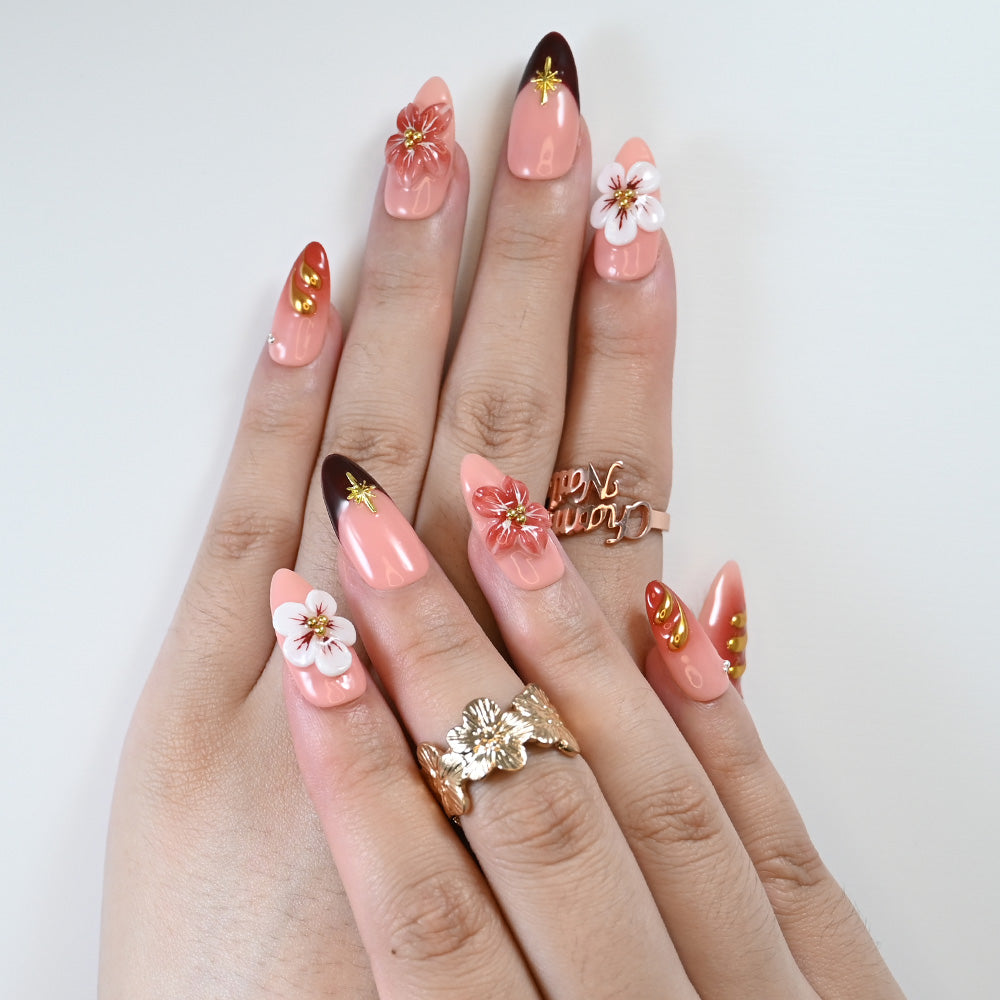 Elegant wedding press-on nails with coral red tones and floral nail art