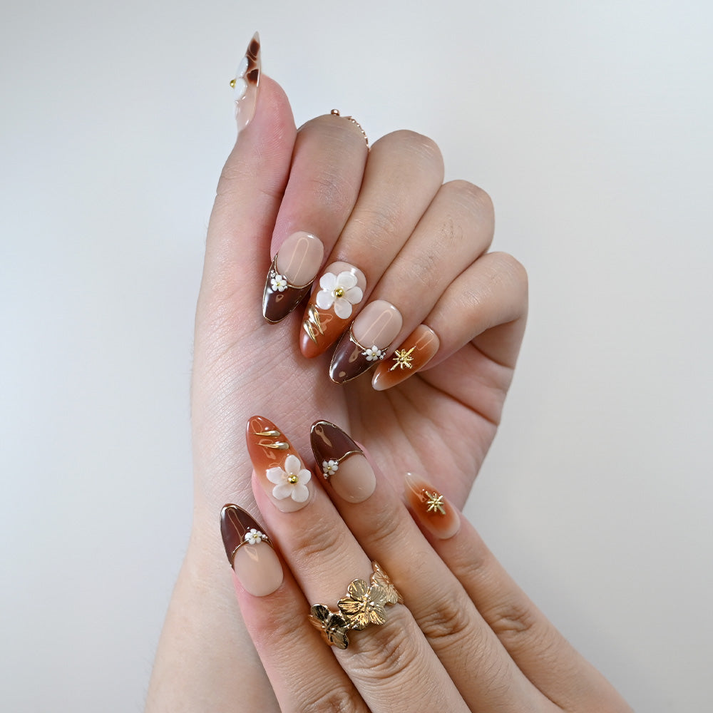 Handmade floral press-on nails in coffee tones with shimmer details