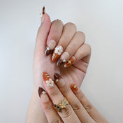 Handmade floral press-on nails in coffee tones with shimmer details