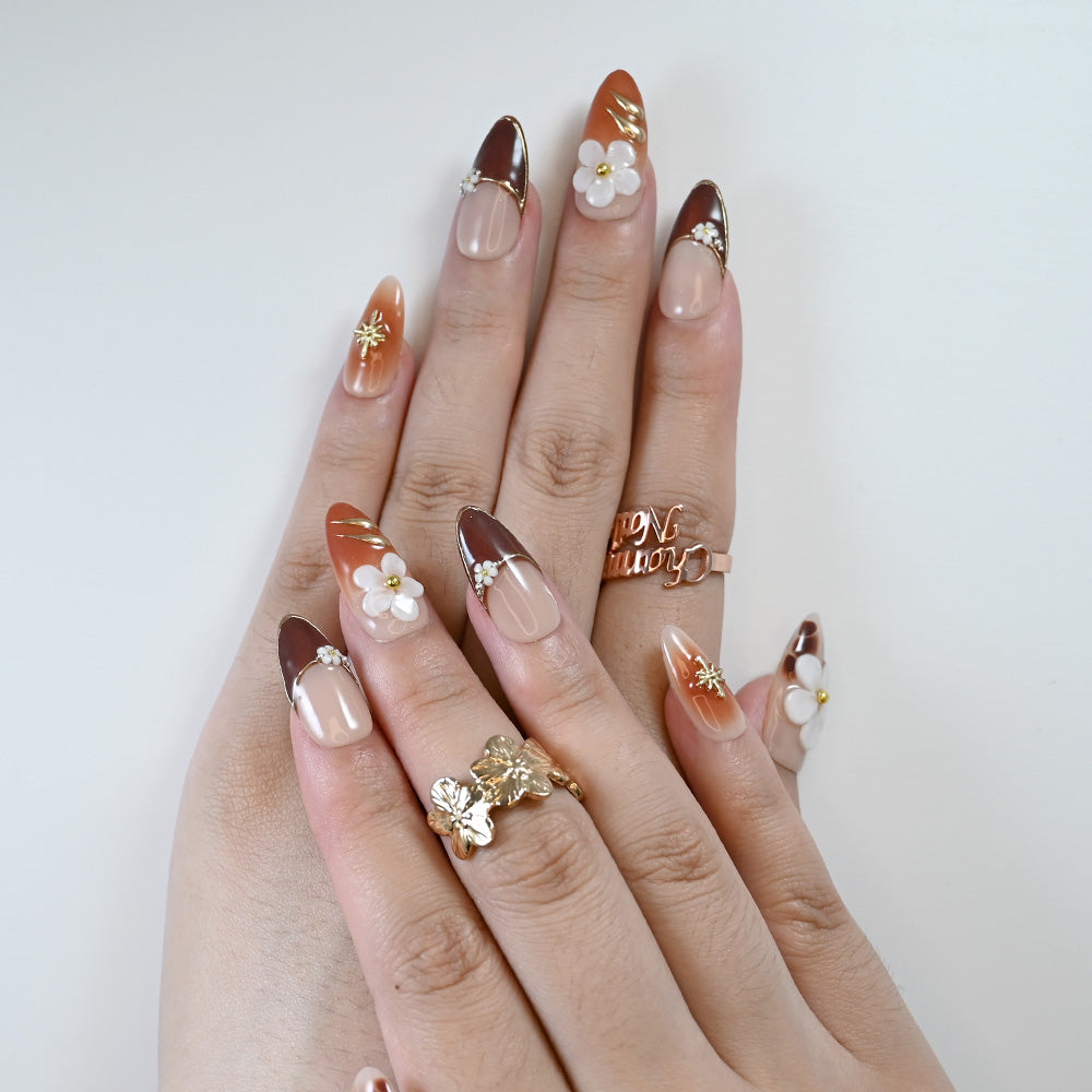 Elegant autumn press-on nails with small flowers and gold star design
