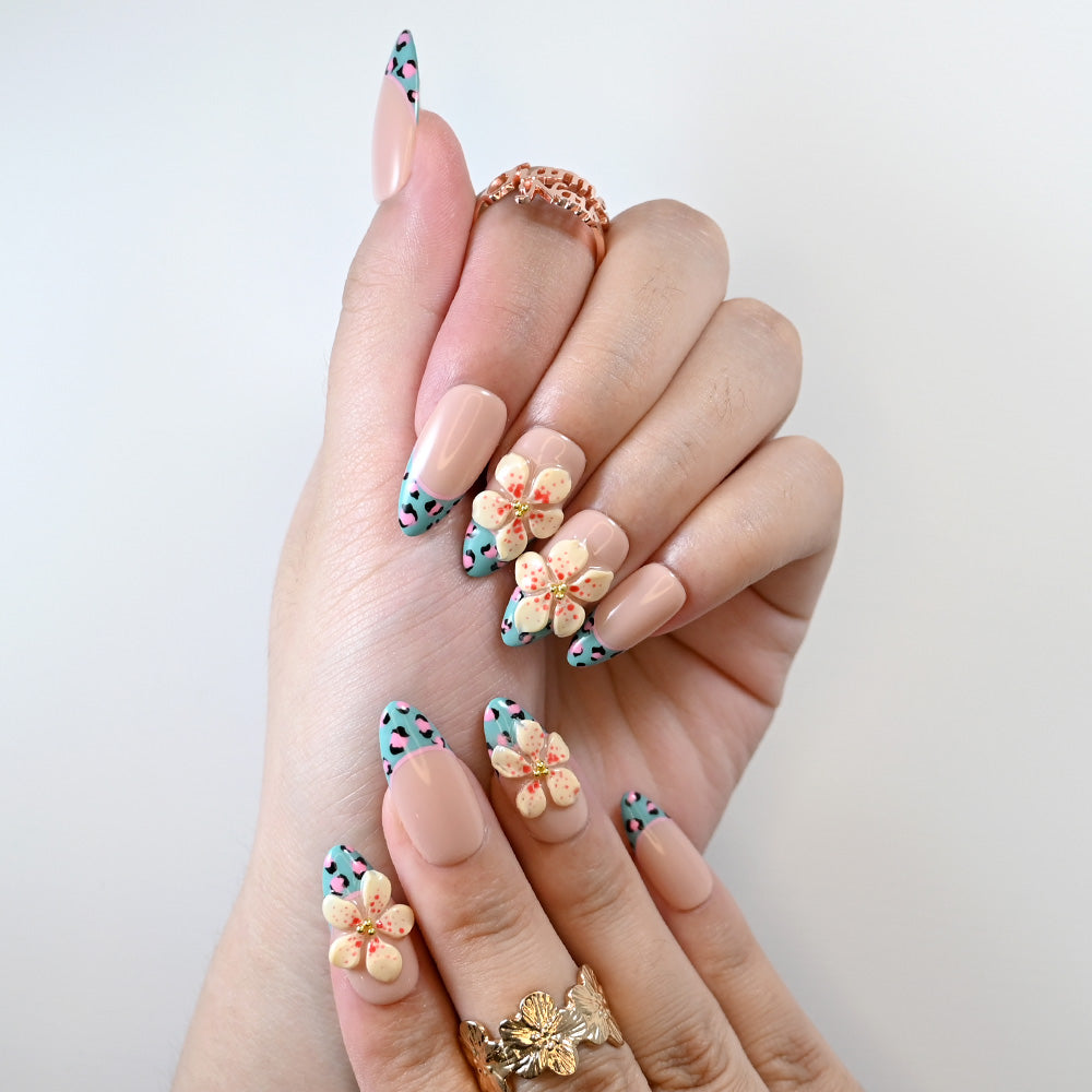Reusable press-on nails with pink leopard pattern and cream flower gems