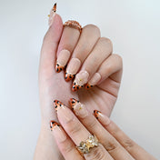 Handmade acrylic nails featuring animal print tips and transparent floral nail art