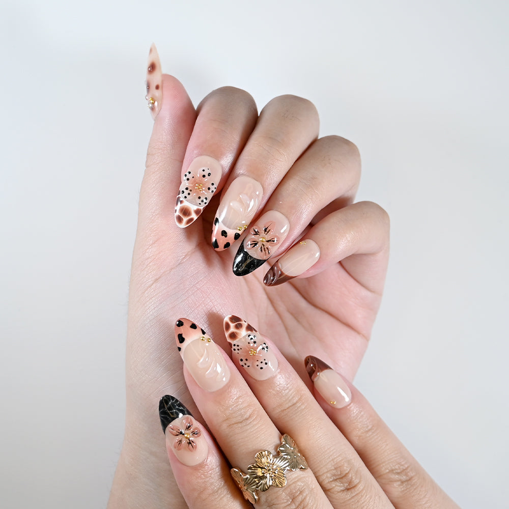 Handmade almond nails with beige base, animal print, and floral design
