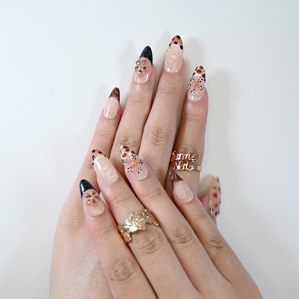 Reusable press-on nails with mocha tones, leopard spots, and 3D blossoms