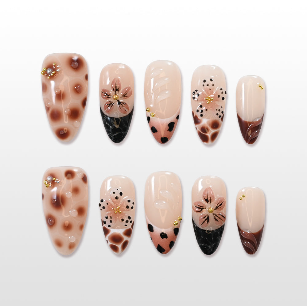 Brown leopard press-on nails with 3D nude flowers and gold accents