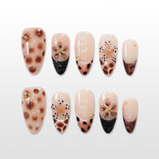Brown leopard press-on nails with 3D nude flowers and gold accents