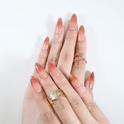Elegant daily wear nails with coral ombre and gold foil touch