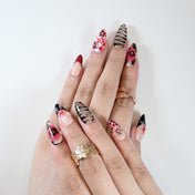 Sexy party press-on nails with red-black stripes and 3D floral details