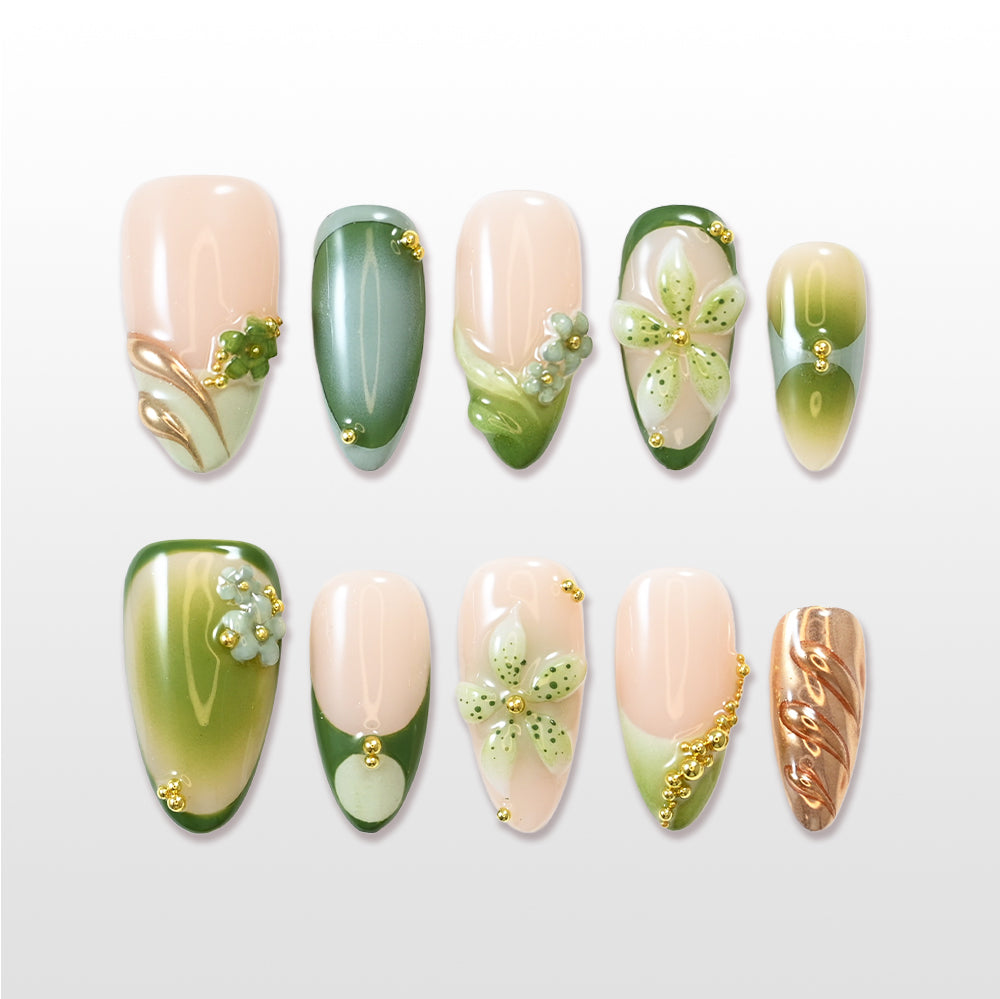 Green gradient press-on nails with 3D floral accents and gold beads
