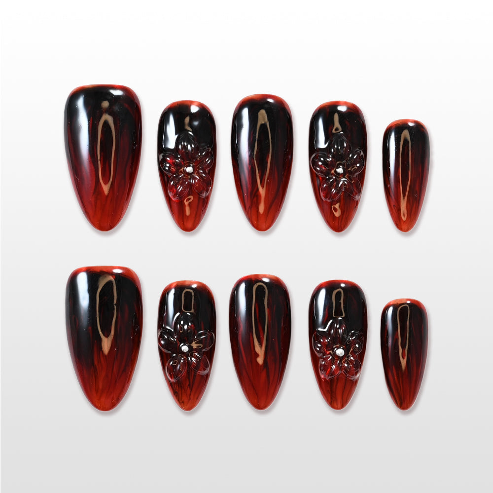 Black and red ombre press-on nails with 3D carved floral design